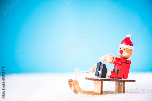 Santa have fun on snow sledge, winter and Christmas time