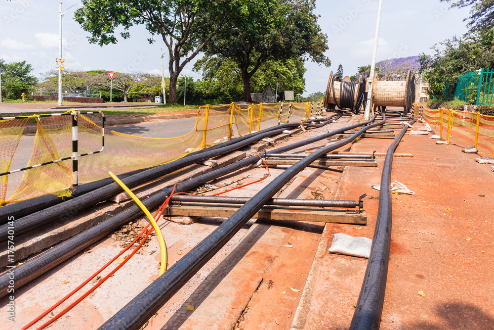 Electricity New Power Cables Installation trenches underground road side. Electricity New Power Cables Installation trenches underground road side.