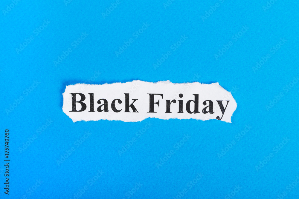 Black Friday text on paper. Word Black Friday on torn paper. Concept Image Black Friday text on paper. Word Black Friday on torn paper. Concept Image