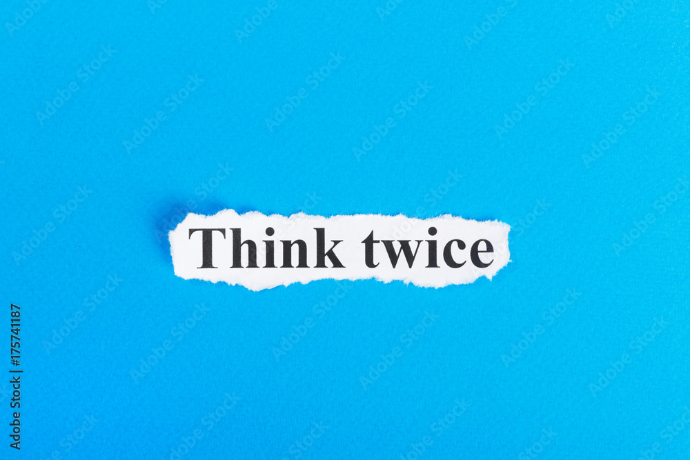 Think twice text on paper. Word Think twice on torn paper. Concept Image Think twice text on paper. Word Think twice on torn paper. Concept Image