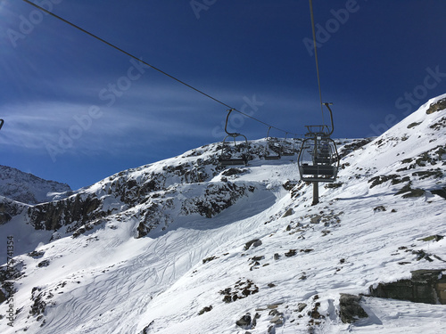 Idyllic mountain scenery, ski lift and slopes in the Alps