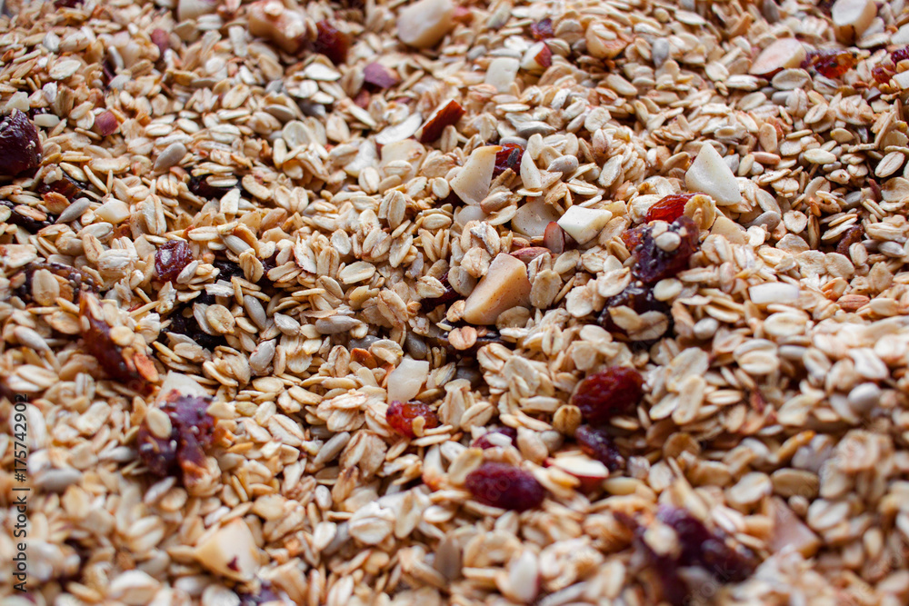 Oven roasted homemade honey granola on baking sheet Oven roasted homemade honey granola on baking sheet