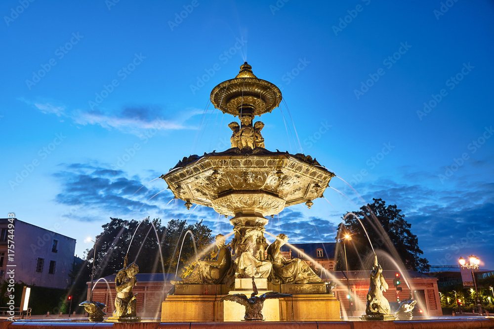 Baroque fountain in the evening in the city of Troyes in France.