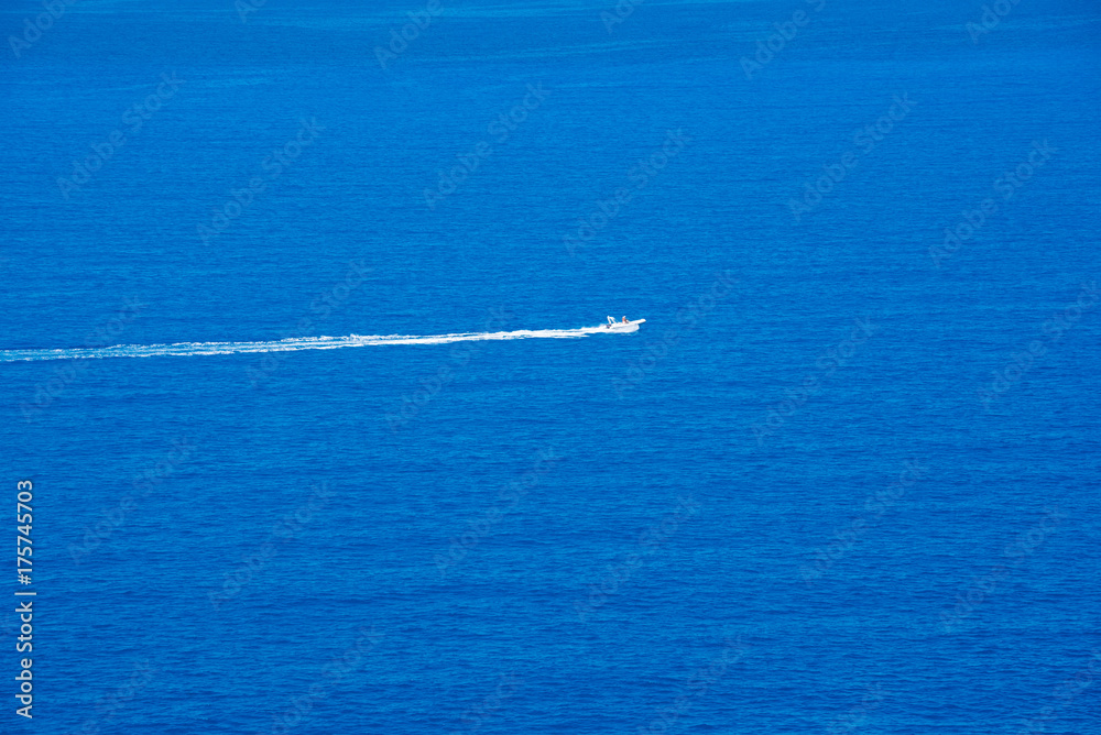 A motor boat going on high speed in blue sea