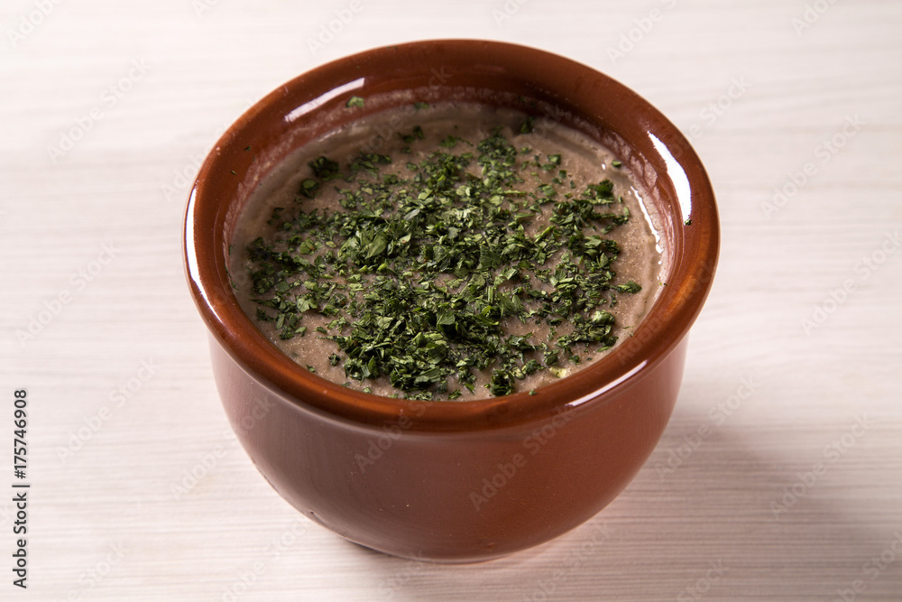 Bean soup in bowl on wooden table background