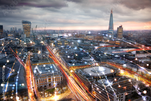 City of London view at night, business network connections concept. 