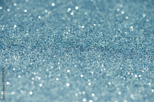abstract defocused lights, sparkling holiday bokeh background with golden ton...
