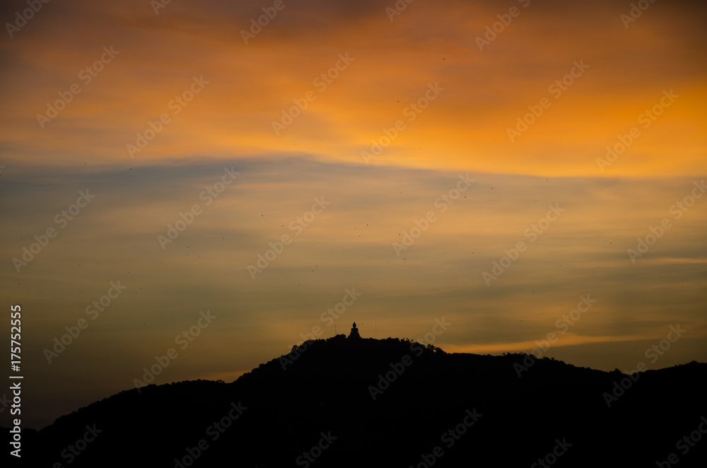 Phuket big buddha on top hill with sunset 