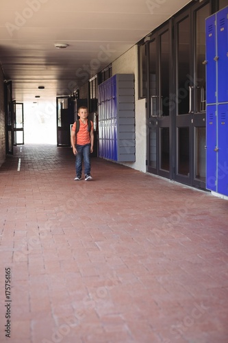 Full length of boy walking in corridor © WavebreakMediaMicro