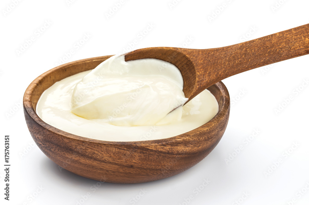 Sour cream in wooden bowl isolated on white background Sour cream in wooden bowl isolated on white background
