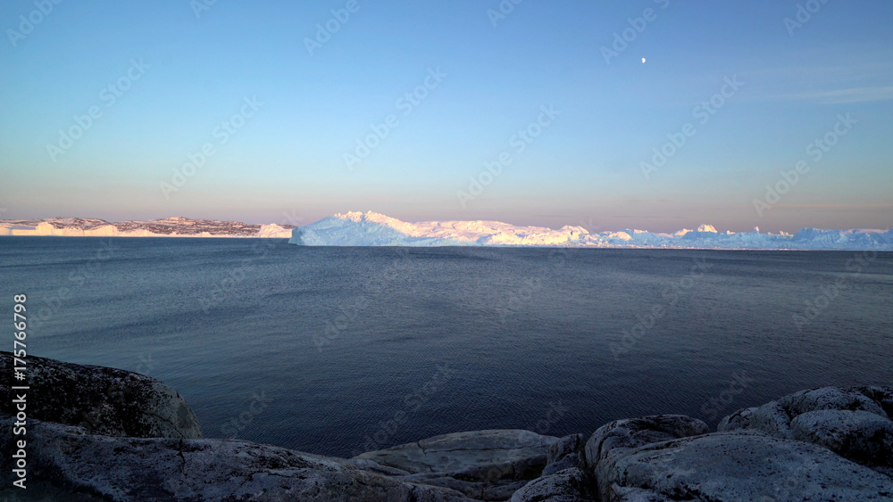 Arctic Icebergs in Greenland. You can easily see that iceberg is over the water surface, and below the water surface. Sometimes unbelievable that 90% of an iceberg is under water Arctic Icebergs in Greenland. You can easily see that iceberg is over the water surface, and below the water surface. Sometimes unbelievable that 90% of an iceberg is under water