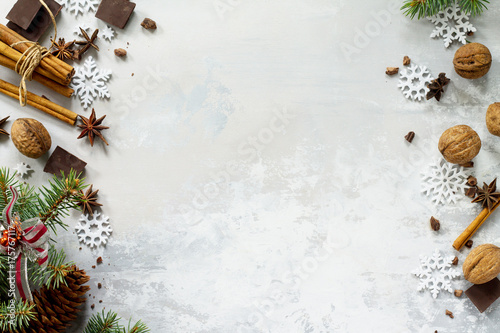 Ingredients for Christmas baking - chocolate, cinnamon, anise and nuts on a stone or slate background. Seasonal, food background. © elena_hramowa