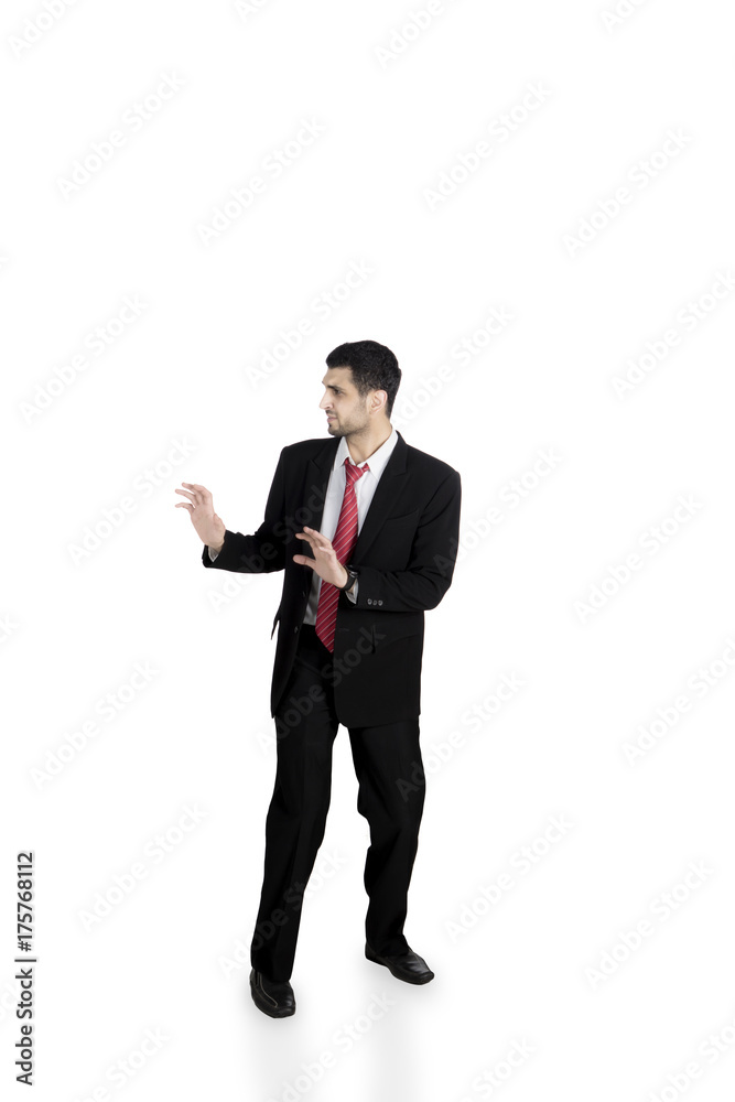Scared businessman is running on studio Scared businessman is running on studio
