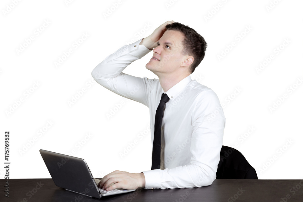 Confused Caucasian businessperson with laptop Confused Caucasian businessperson with laptop