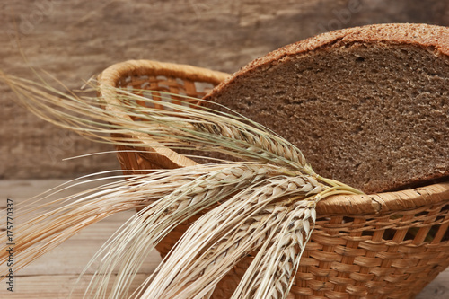 rye bread and ears of corn in basket