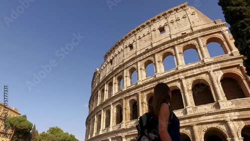Woman looking at the colloseum in slow motion