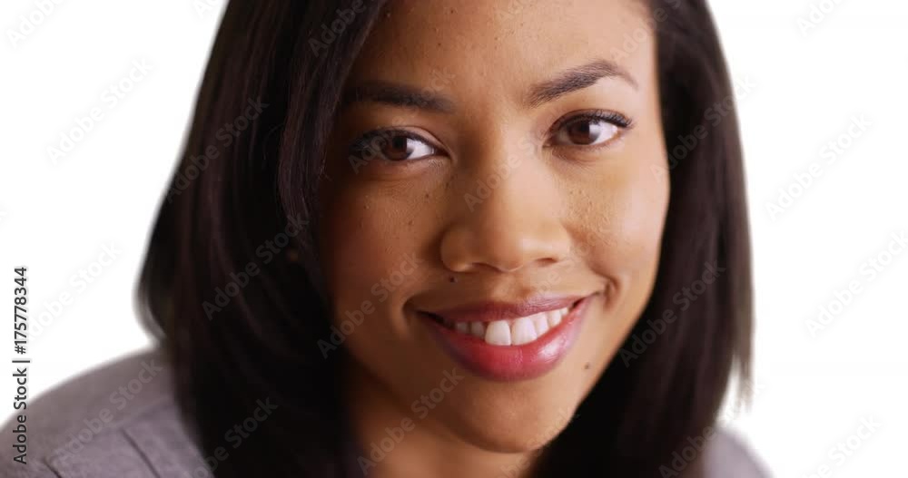 Close up of beautiful black female with bright, cheerful smile in studio Close up of beautiful black female with bright, cheerful smile in studio
