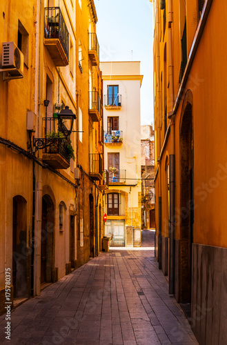 charming narrow street, street with colorful facades of buildings, vintage style
