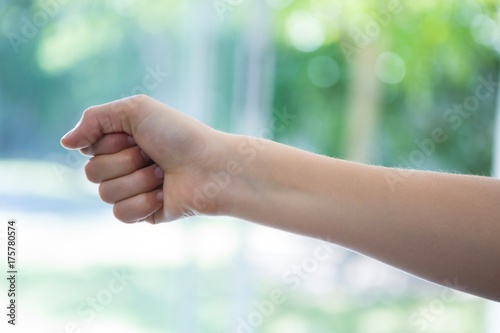 Cropped image of hand clenching fist © WavebreakMediaMicro