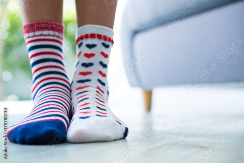 Low section of girl wearing patterned socks