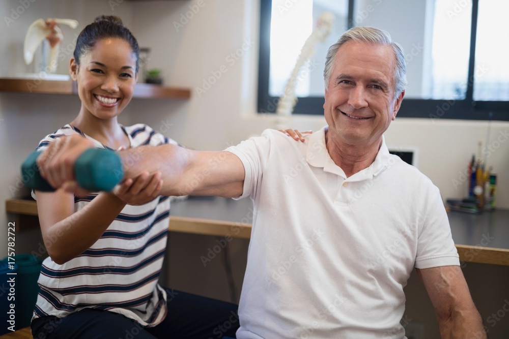 Portrait of smiling female doctor with senior male patient Portrait of smiling female doctor with senior male patient