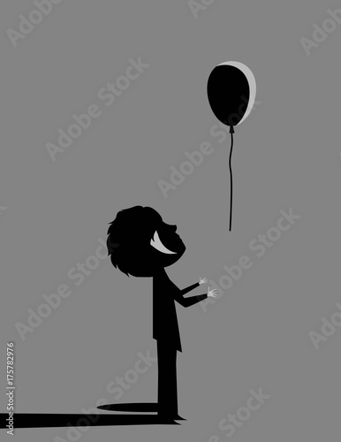 boy letting out a ballon