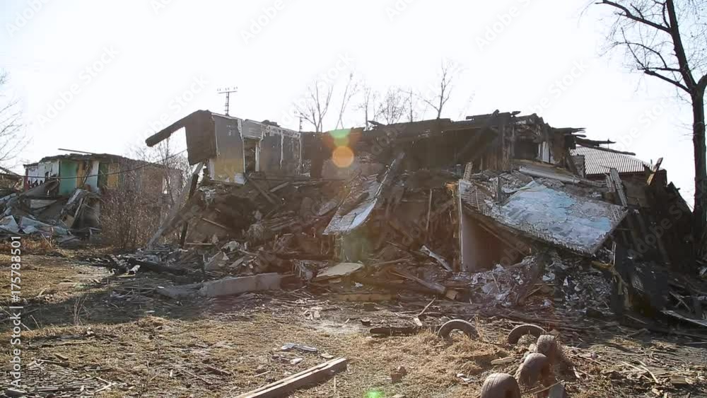 Consequences of the disaster. Ruined wooden houses Consequences of the disaster. Ruined wooden houses