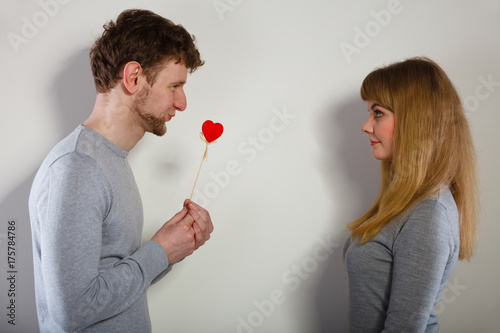Man giving heart to his girl.