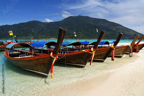 long tail boat, in white sand beach in andaman sea