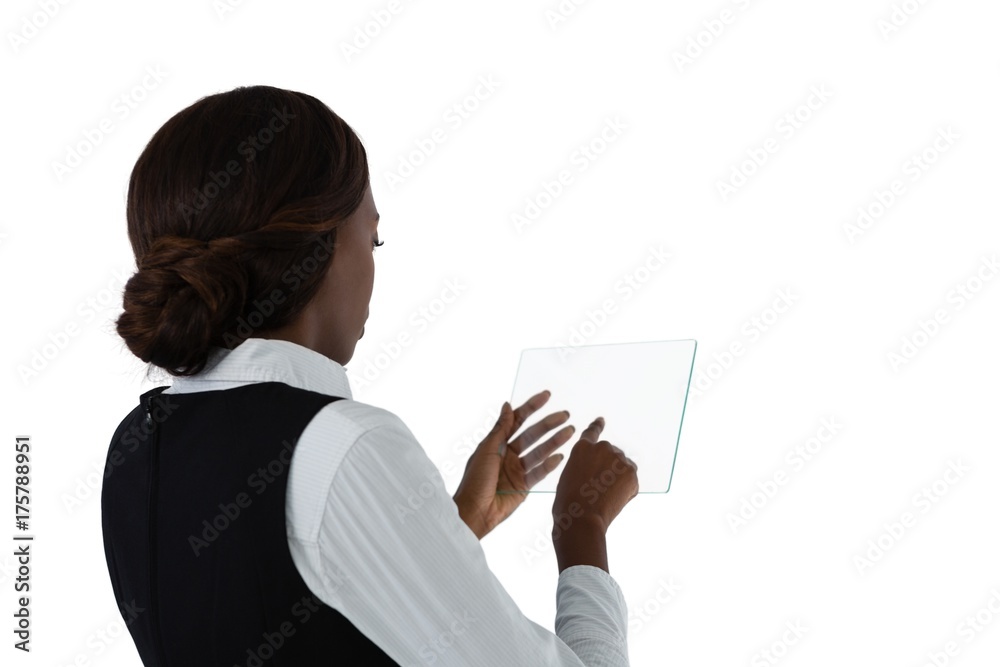 Side view of businesswoman with brown hair using glass interface Side view of businesswoman with brown hair using glass interface