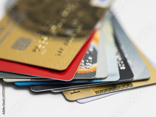 Stack of multicolored credit cards close-up	
