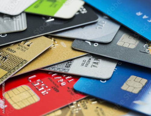 Stack of multicolored credit cards close-up	
