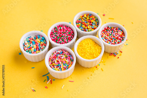 Confectionery sprinkles on a yellow background