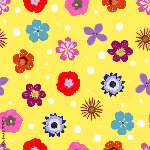Seamless yellow pattern with scattered colorful flowers and white dots - Eps10 vector graphics and illustration
