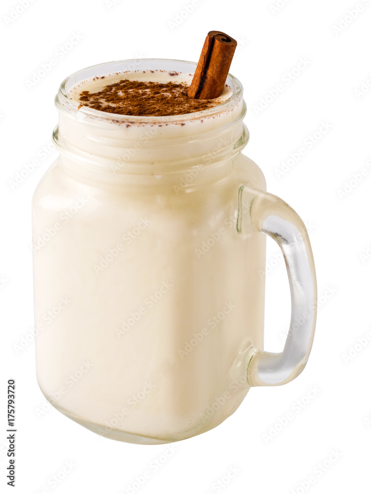 Homemade eggnog in mason jar isolated Homemade eggnog in mason jar isolated