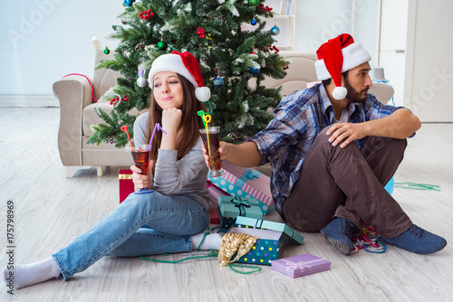 Young pair in conflict situation during christmas night photo