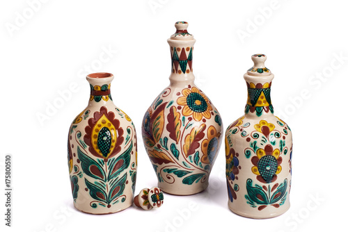 Still life with ceramic handmade bottles. Isolated on a white background