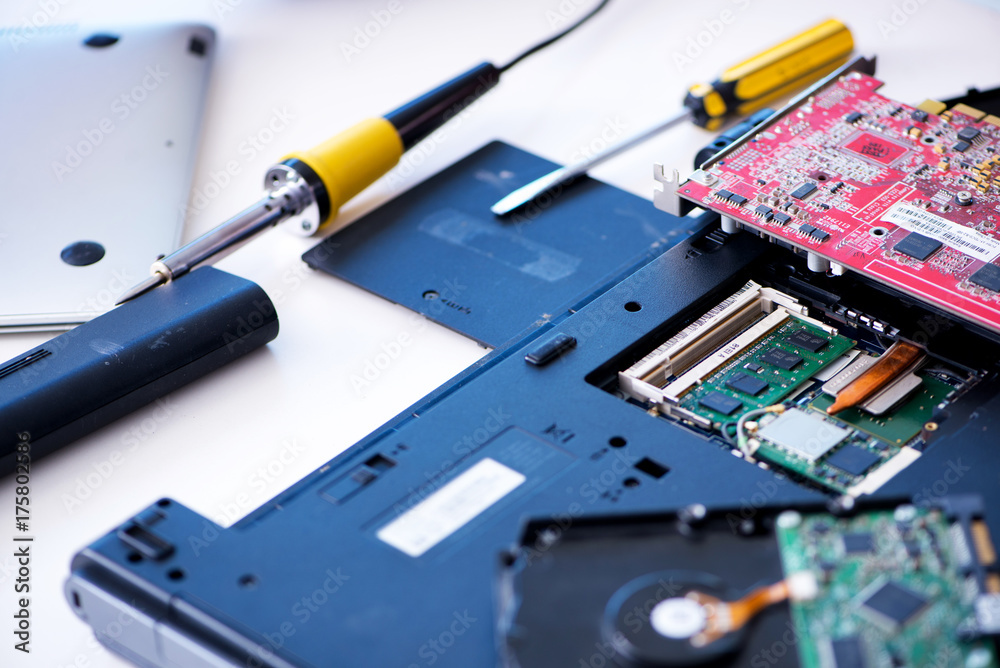 Repairman working in technical support fixing computer laptop tr Repairman working in technical support fixing computer laptop tr