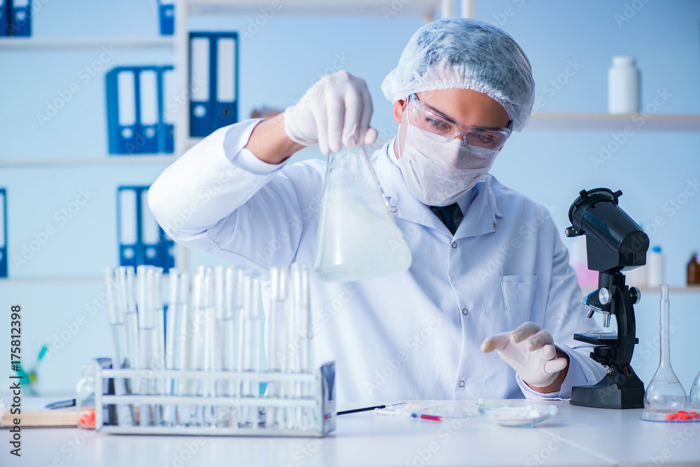 Female scientist researcher conducting an experiment in a labora Female scientist researcher conducting an experiment in a labora