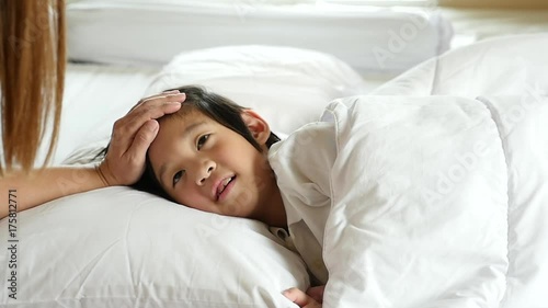 Cute Asian child sleeping on white bed with mother care slow motion 