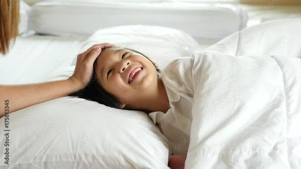 Cute Asian child sleeping on white bed with mother care slow motion Cute Asian child sleeping on white bed with mother care slow motion