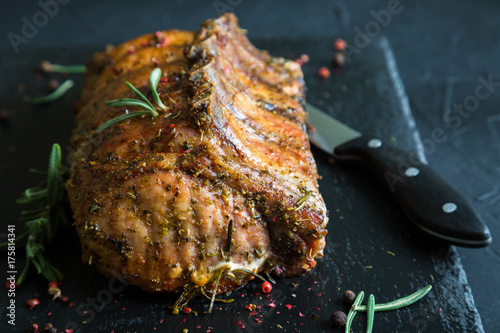 Slika na platnu Pork loin on bone baked with herbs