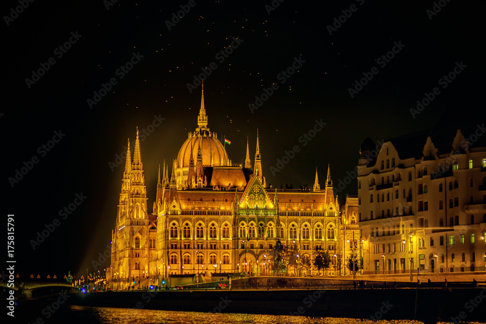 Fototapeta premium The Hungarian Parliament Building is the seat of the National Assembly of Hungary, one of Europe's oldest legislative buildings, a notable landmark of Budapest. Night-view with Danube river.