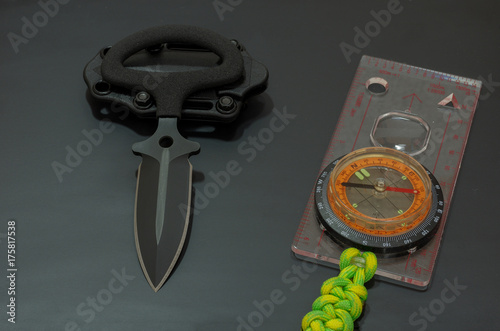 Knife military and compass. photo