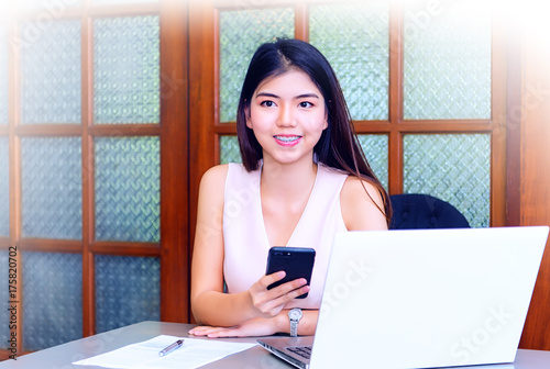 beautiful woman on the workplace using a digital tablet.