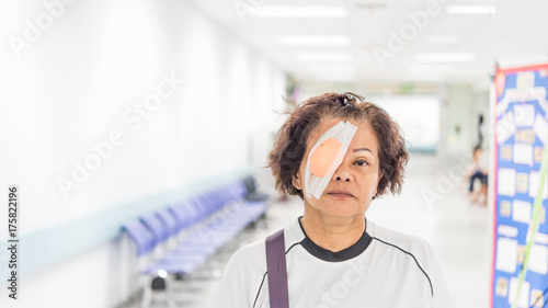 Patient asian women show her eyes with eye shield