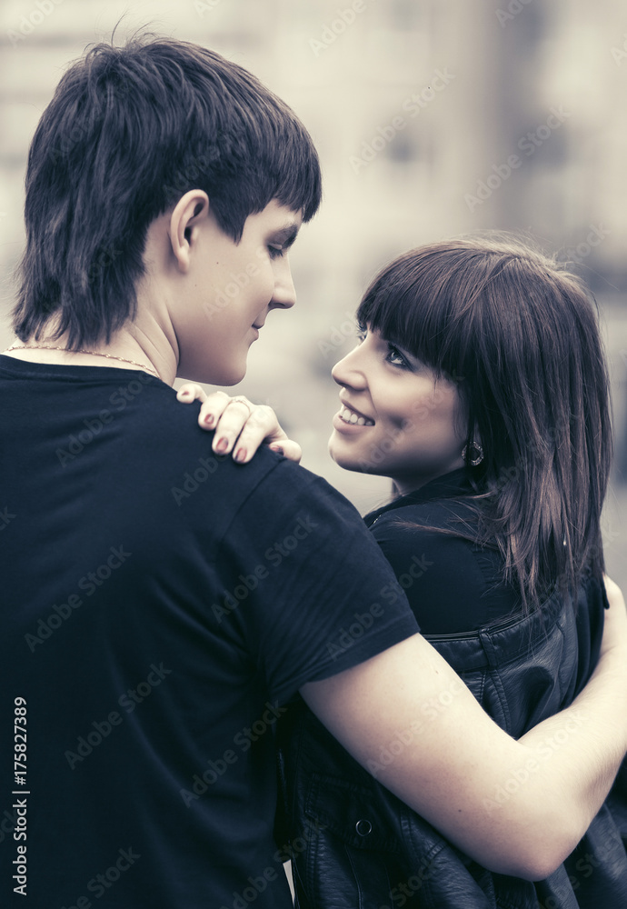 Happy young couple in love in city street
