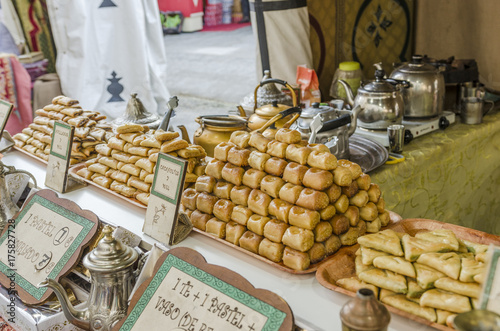 Arabic fresh sweets in a medieval market photo
