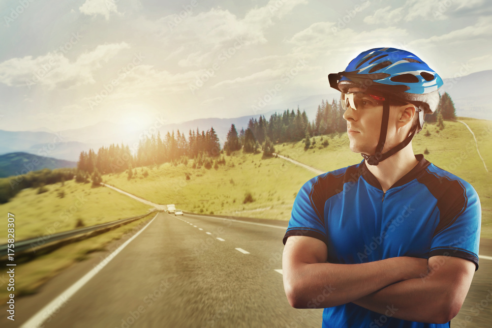 cyclist portrait on a background of a picturesque mountain landscape