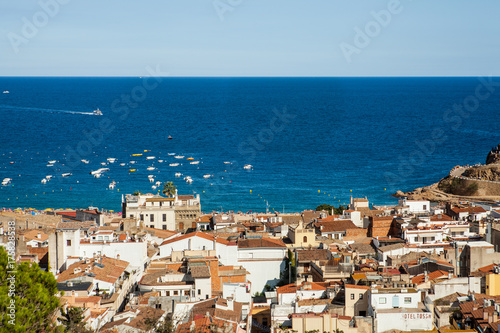 Top view of the town of Tossa de mar, city on the Costa Brava. Buildings and hotels by the beach. Amazing city in Girona, sea and moored boats in Catalonia. City and see.